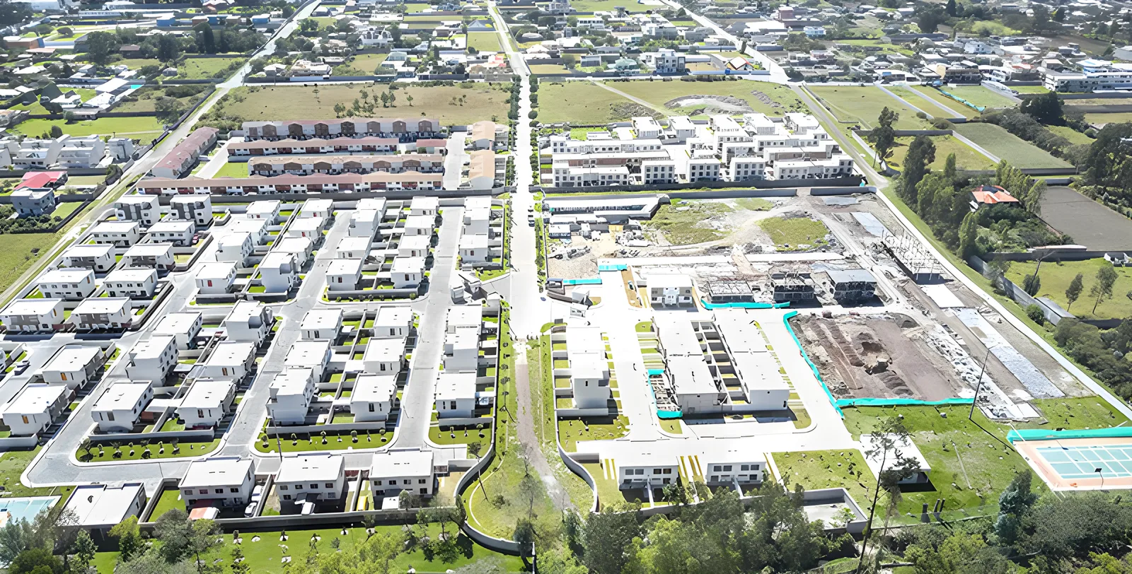 Vista aérea del conjunto completo con calles, casas y canchas, Jardines del Dean